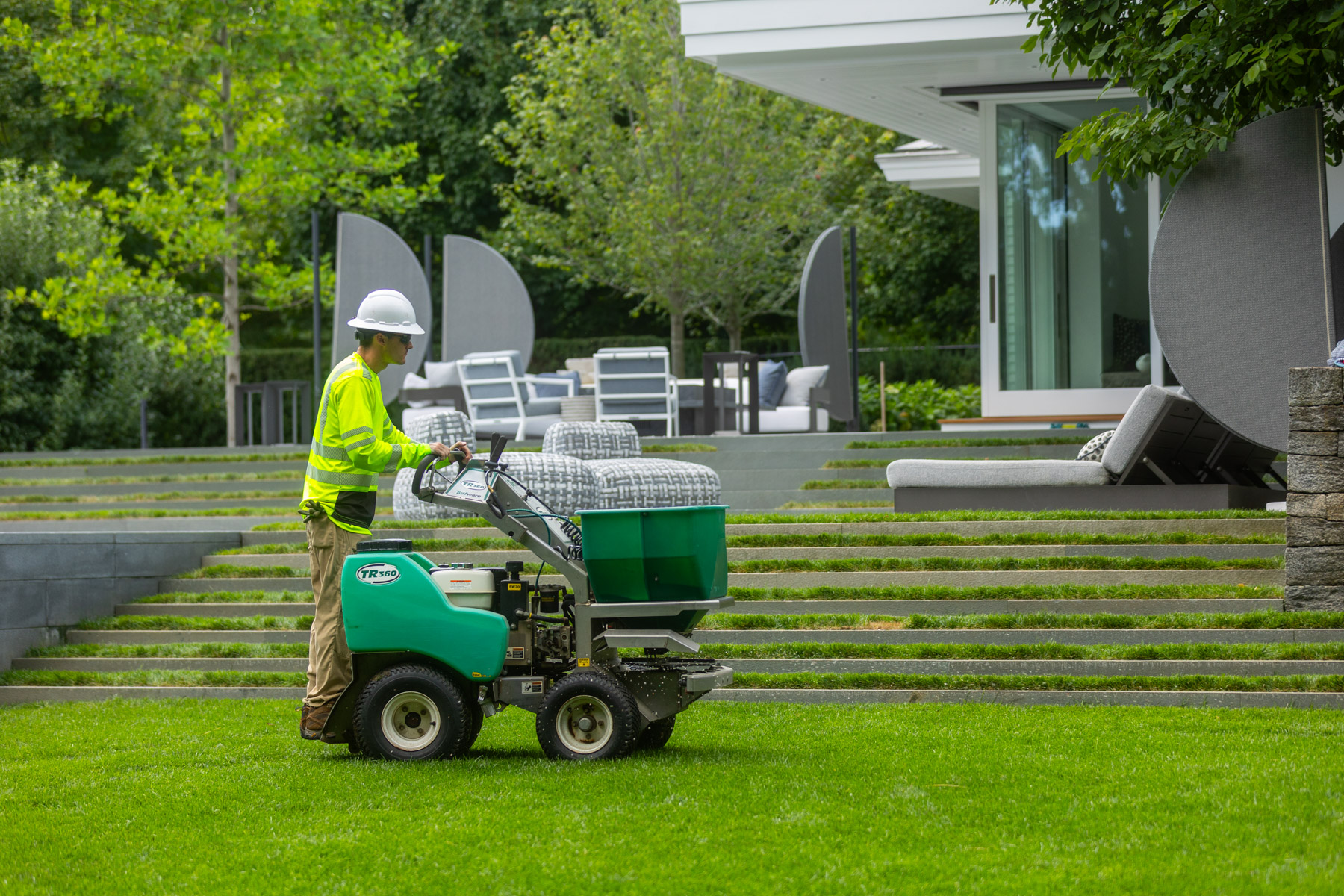barrett-tree-service-lawn-care-technician-green-ride-on-fertilizer-application-day2-157
