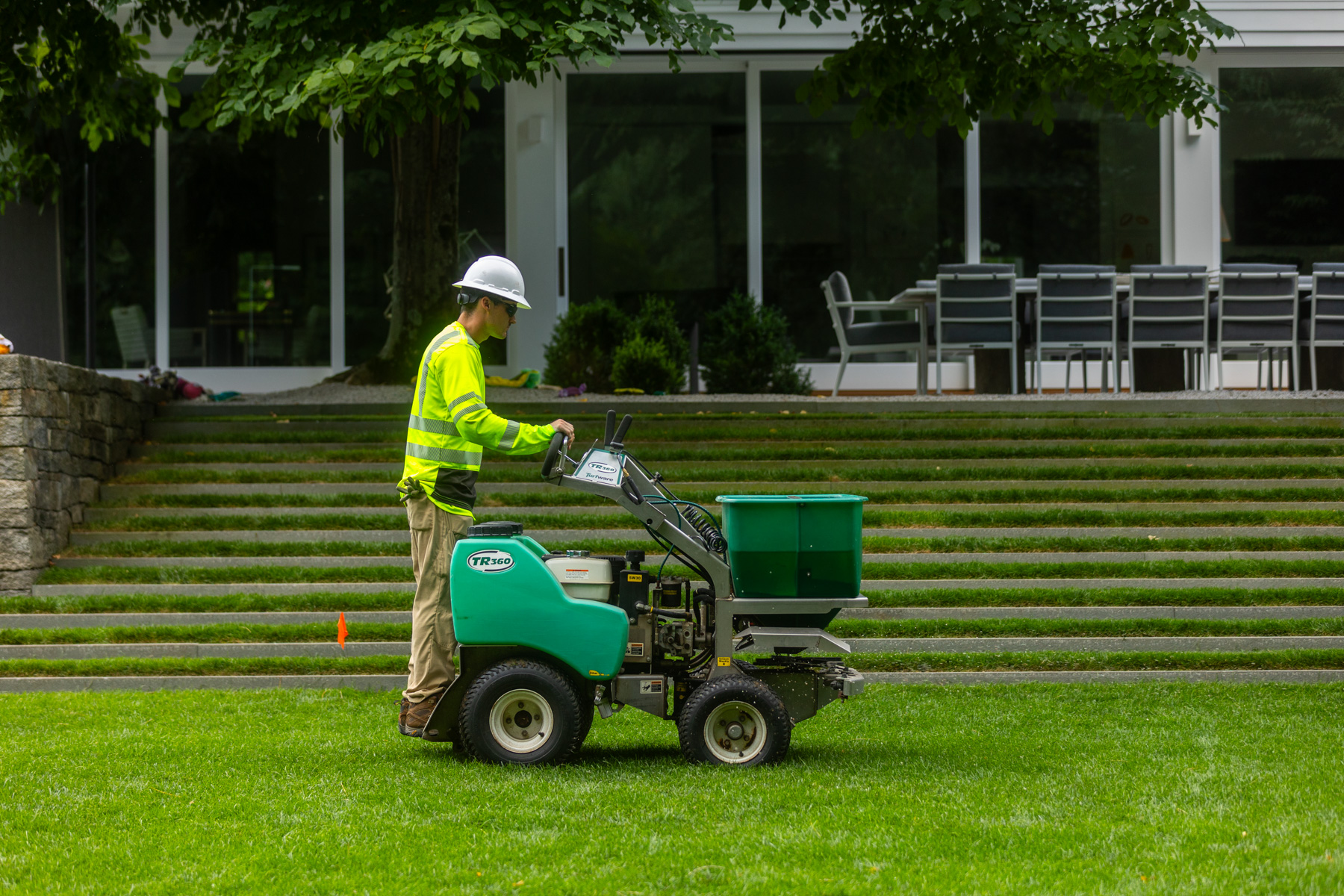 barrett-tree-service-lawn-care-technician-green-ride-on-fertilizer-application-day2-158